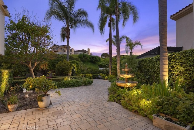 view of patio terrace at dusk