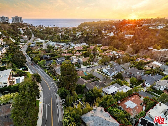 aerial view at dusk with a water view