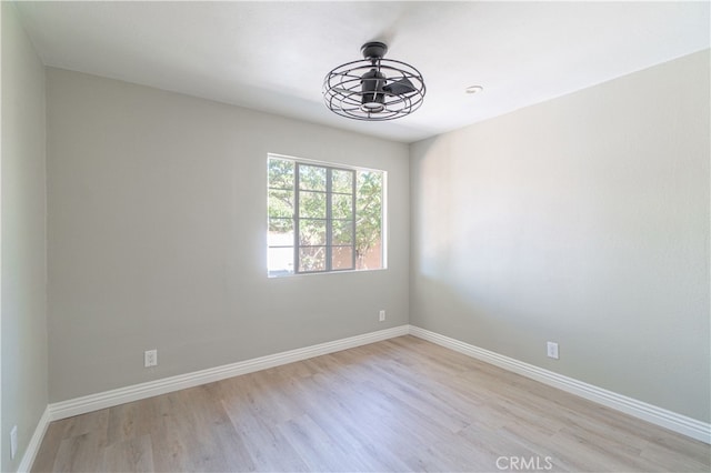 unfurnished room with light hardwood / wood-style flooring