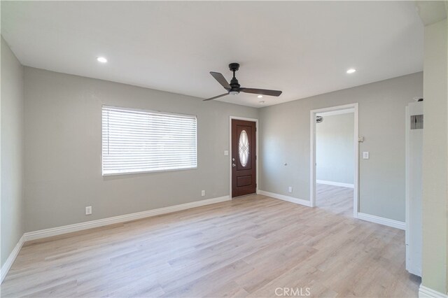 foyer with light wood-type flooring and ceiling fan