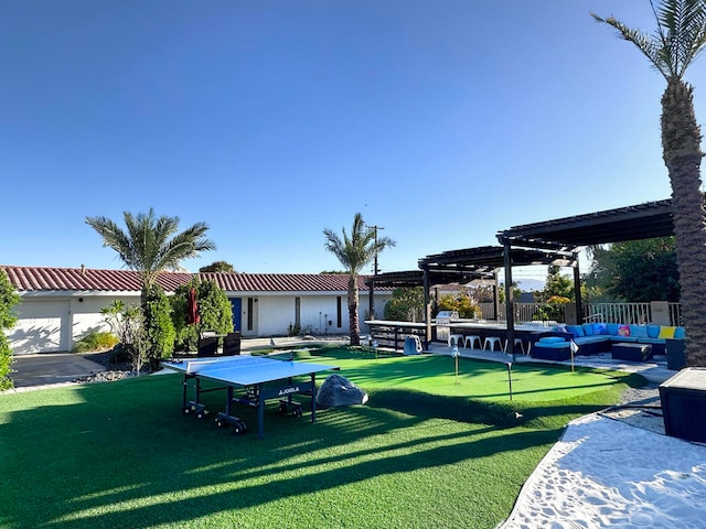 view of yard with a pergola and an outdoor living space