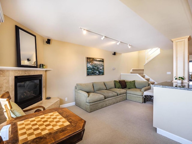 living room with carpet and a fireplace