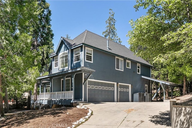 view of front of home featuring covered porch and a garage