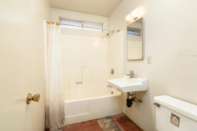 full bathroom with sink, shower / bath combination with curtain, and toilet