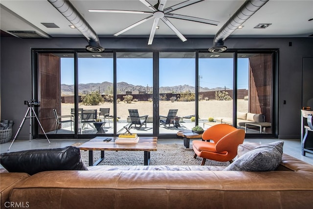 living room featuring a mountain view and an inviting chandelier