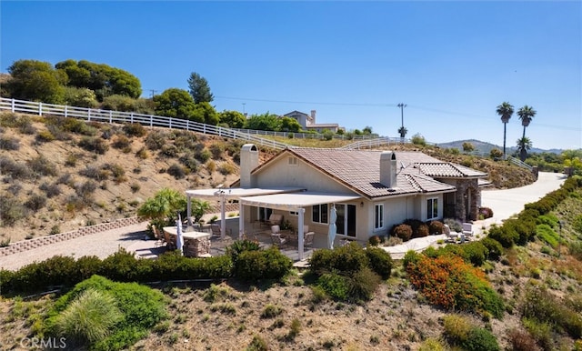 back of property featuring a patio area