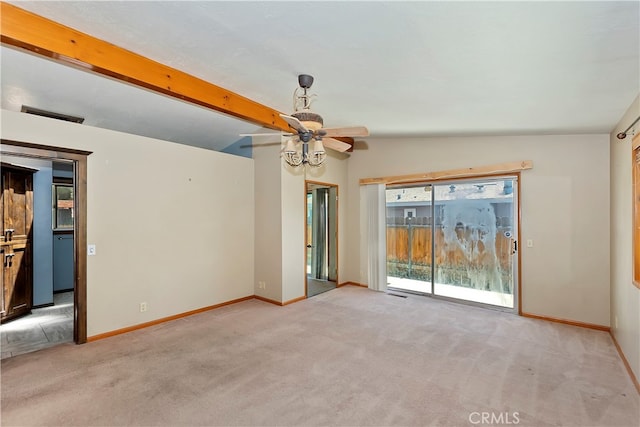 carpeted spare room with ceiling fan and lofted ceiling with beams