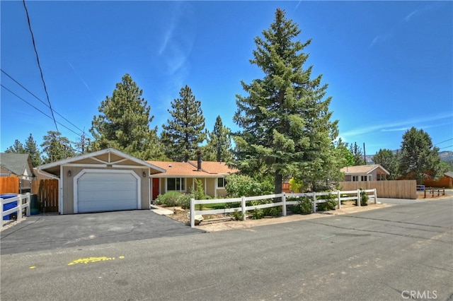 ranch-style home featuring a garage