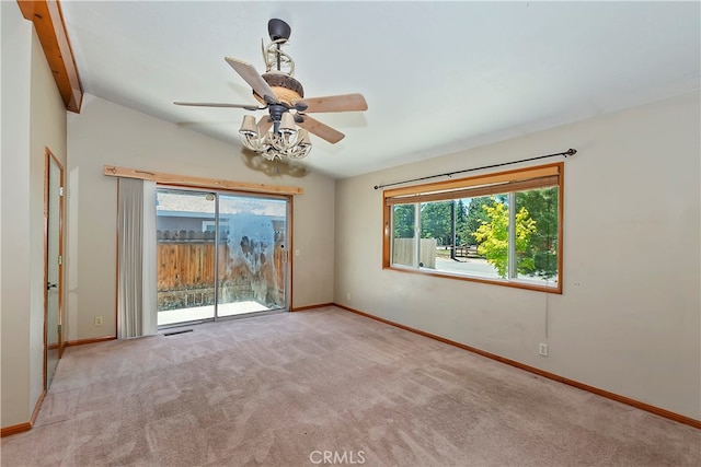 empty room featuring light carpet, lofted ceiling, and ceiling fan