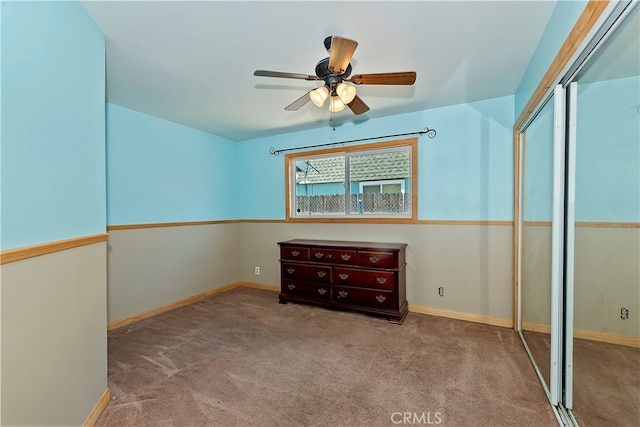 unfurnished bedroom featuring light carpet, ceiling fan, and a closet