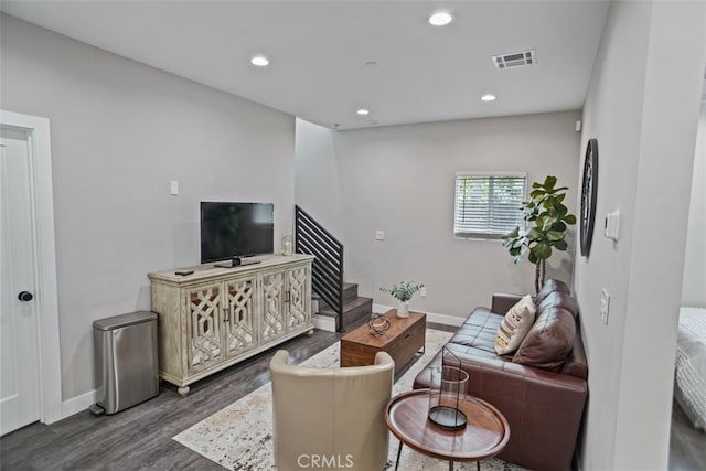 living room featuring dark hardwood / wood-style floors