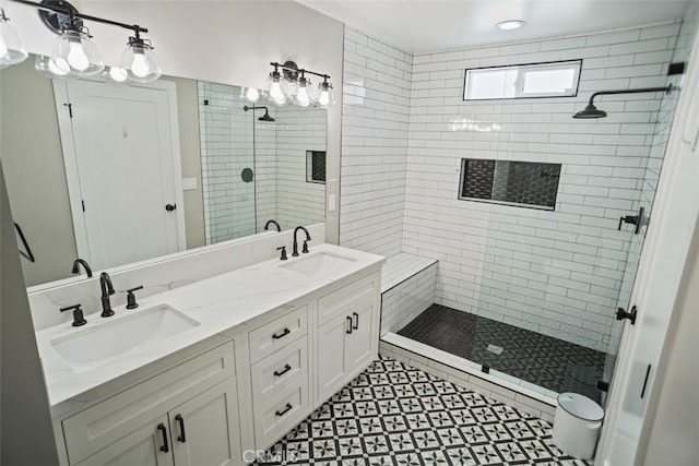 bathroom featuring an enclosed shower and vanity