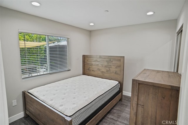 bedroom featuring dark hardwood / wood-style floors