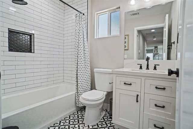 full bathroom featuring tile patterned flooring, shower / bath combo, vanity, and toilet