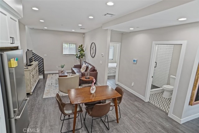 dining area with hardwood / wood-style floors