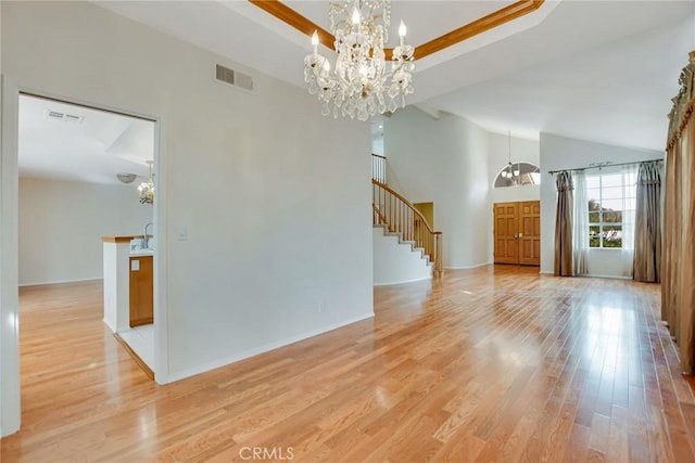 interior space with light hardwood / wood-style flooring and a notable chandelier