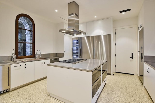 kitchen featuring a kitchen island, black dishwasher, island range hood, white cabinetry, and stainless steel gas cooktop