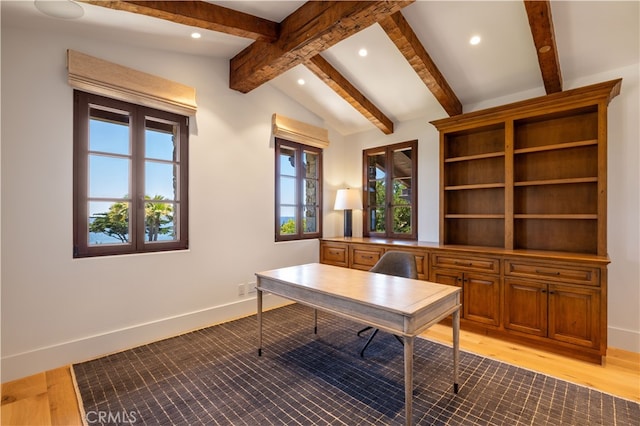 home office featuring lofted ceiling with beams and light wood-type flooring