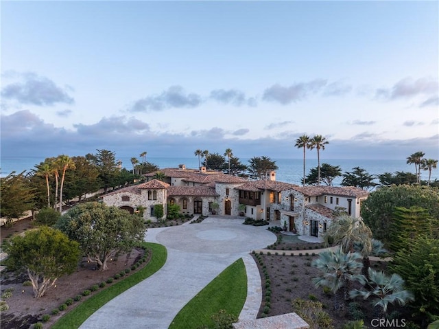 back of house featuring a water view