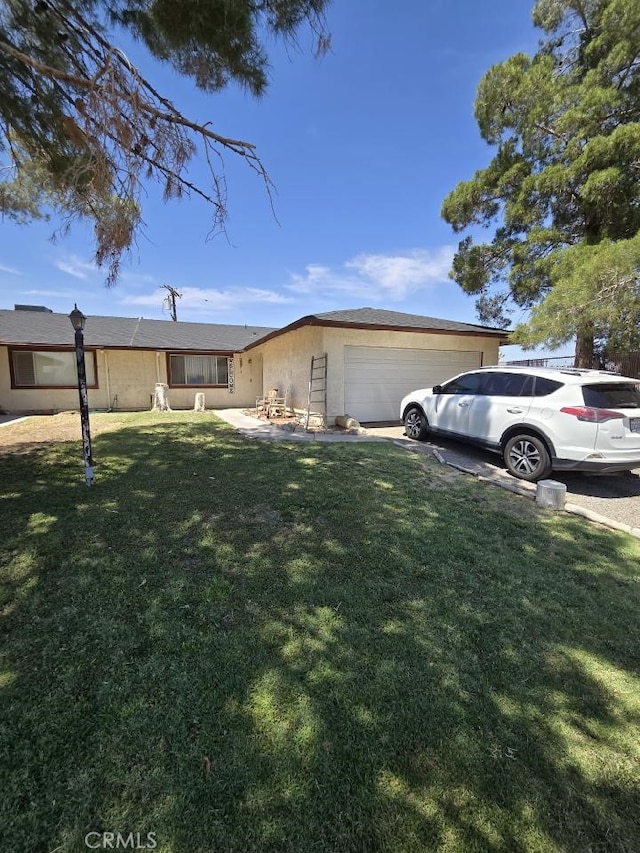 exterior space featuring a front yard and a garage