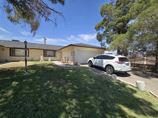 single story home with a garage and a front lawn