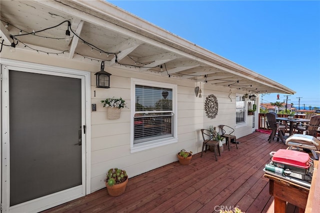 wooden deck with grilling area