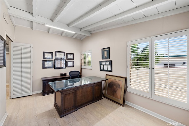 office space featuring lofted ceiling with beams and light hardwood / wood-style floors