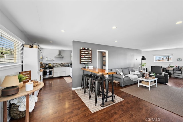 living room with dark hardwood / wood-style floors