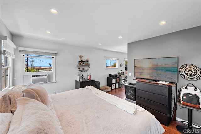 bedroom featuring cooling unit and dark wood-type flooring