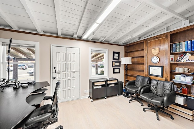 office area featuring vaulted ceiling with beams, light hardwood / wood-style flooring, and wooden ceiling