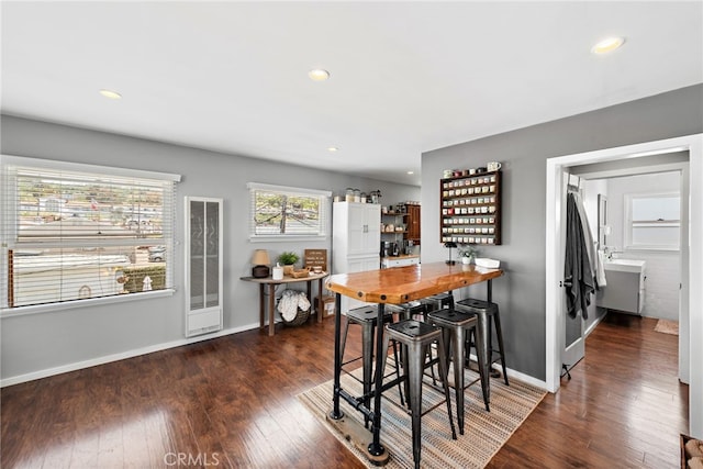 dining area featuring dark hardwood / wood-style flooring