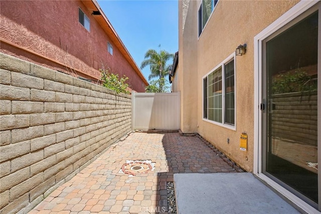 view of property exterior with a patio