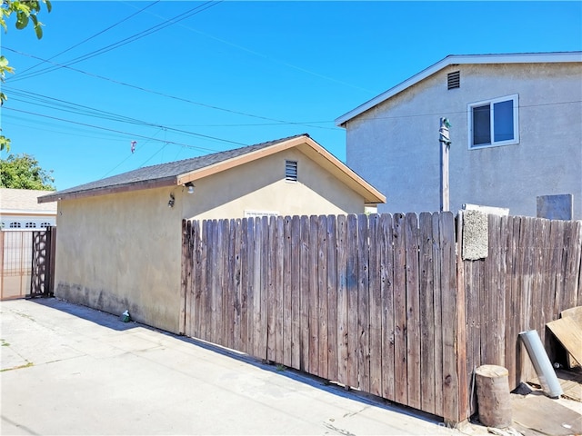 view of side of property featuring a patio area