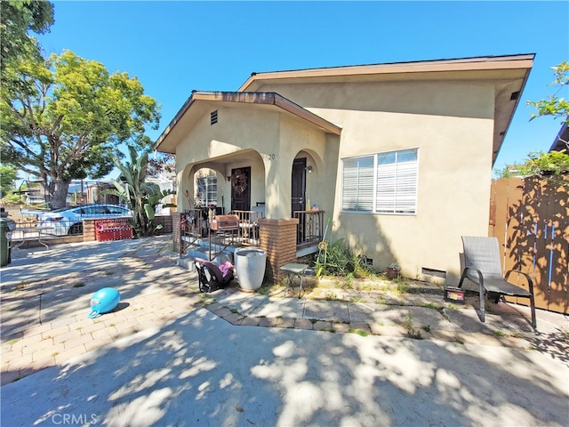 view of front of home with a patio area