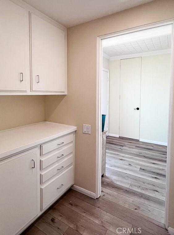 interior space with dark wood-style floors and baseboards