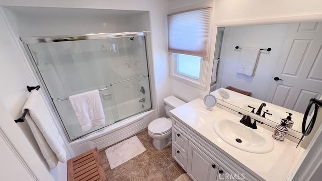 full bathroom with bath / shower combo with glass door, toilet, and vanity