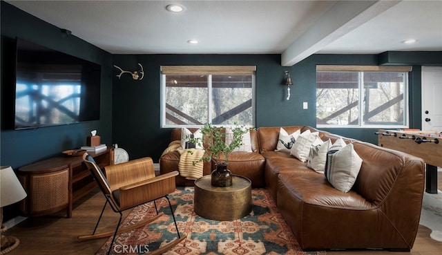 interior space with beam ceiling, hardwood / wood-style flooring, and plenty of natural light