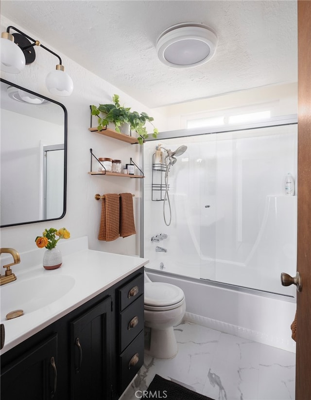 full bathroom with vanity, toilet, combined bath / shower with glass door, and a textured ceiling