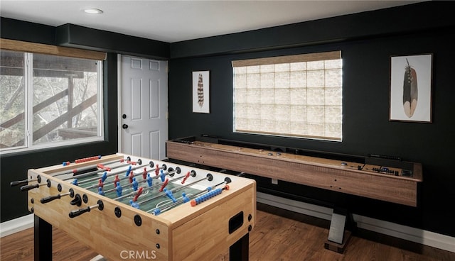 recreation room with dark hardwood / wood-style floors