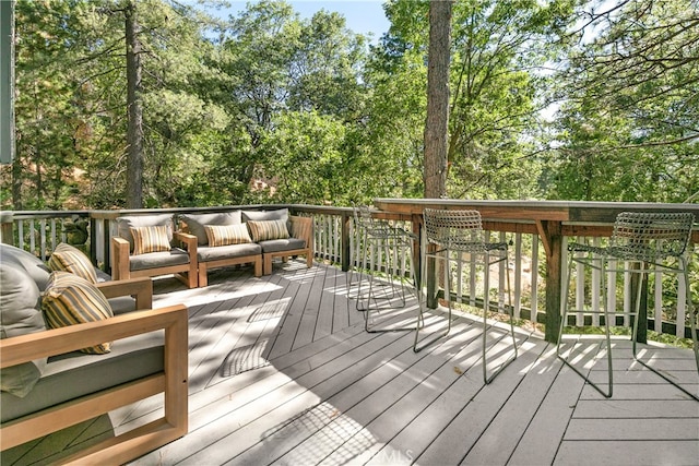 wooden terrace featuring an outdoor hangout area