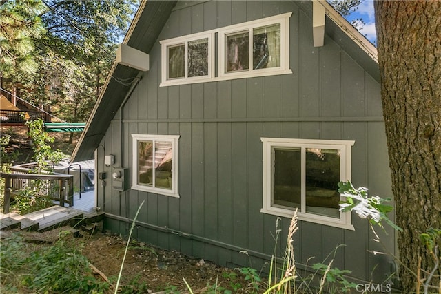 view of home's exterior with a wooden deck