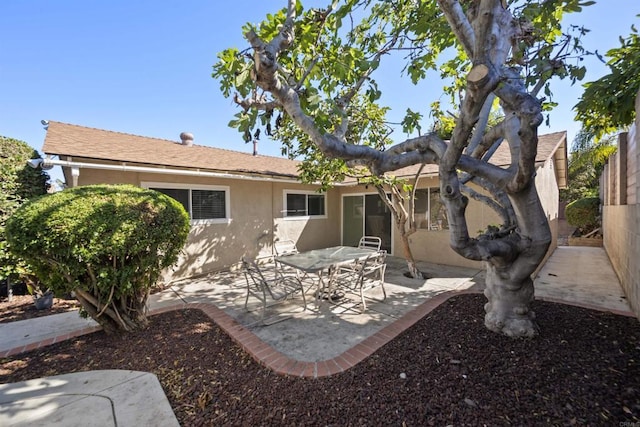 rear view of property featuring a patio