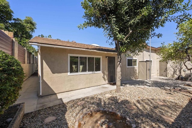 rear view of house with a patio