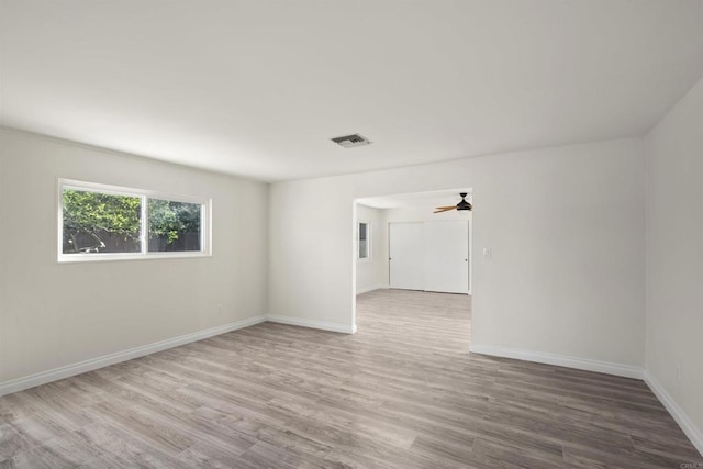 spare room featuring ceiling fan and hardwood / wood-style flooring