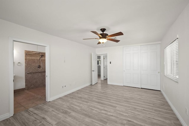 unfurnished bedroom with ceiling fan and light hardwood / wood-style floors