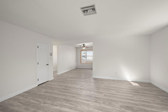 empty room featuring ceiling fan and light hardwood / wood-style flooring