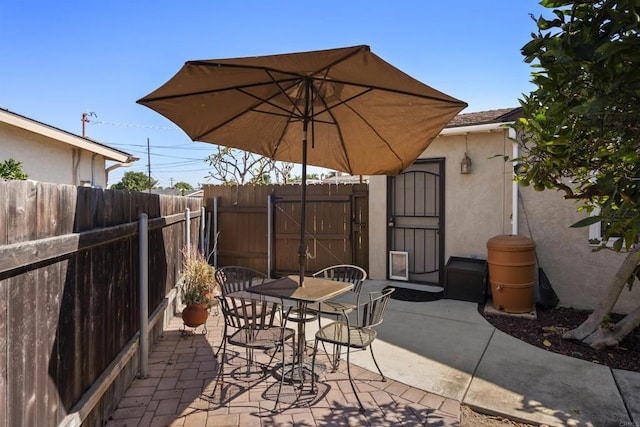 view of patio / terrace with a shed