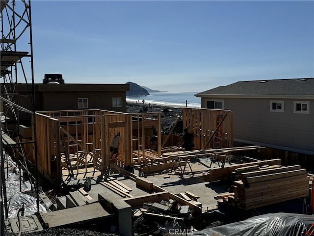 wooden terrace featuring a water view