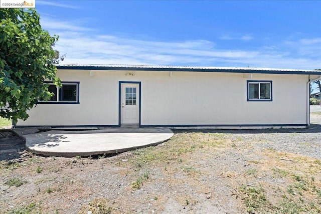 rear view of house featuring a patio area