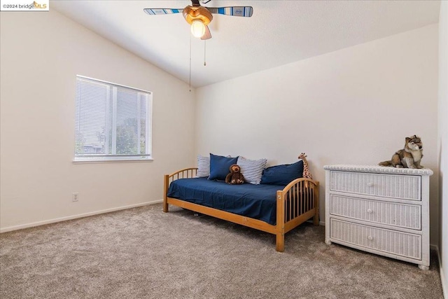 bedroom with ceiling fan, carpet floors, and vaulted ceiling